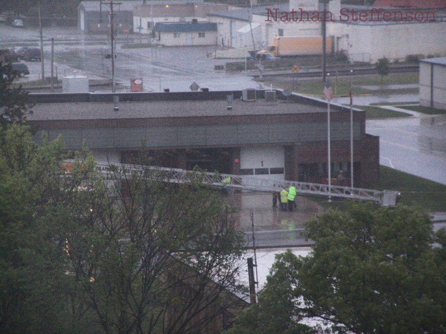 ladder truck and firefighters in yellow