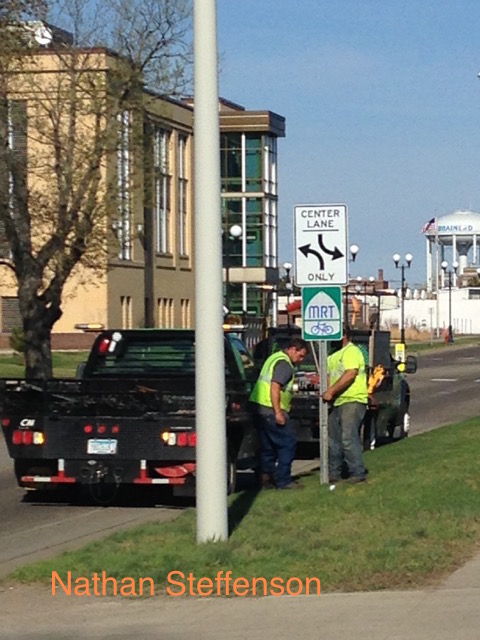 Workers putting in new sign